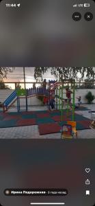 a picture of a playground with a slide at Апартаменти Аліканте in Zatoka