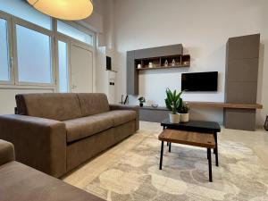 a living room with a couch and a table at Loft43 in Trani