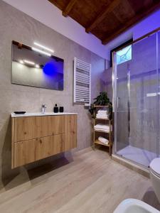 a bathroom with a sink and a shower at Loft43 in Trani