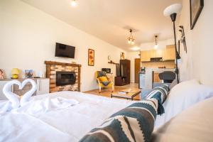 a room with a bed with a heart on it at Edelweiss Studio - Aspen Valley in Razlog
