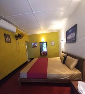 a bedroom with a large bed in a room at Amith Villa in Koggala