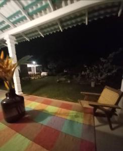 a room with a rainbow floor with a table and a chair at Amith Villa in Koggala