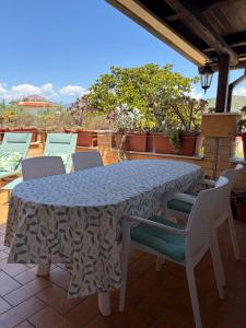 a table and chairs sitting on a patio at Casa Noemi in Sperlonga