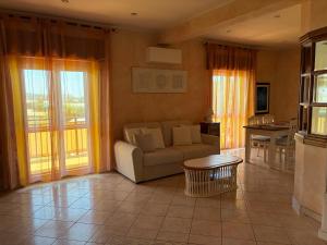 a living room with a couch and a table at Casa Noemi in Sperlonga