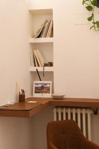 a desk in a room with a book shelf at Residenza IL COLLE in Subiaco