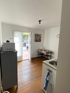 a kitchen with a sink and a counter top at Studio in Brando