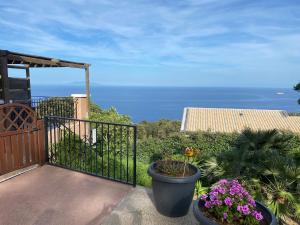 a balcony with a view of the ocean at Studio in Brando