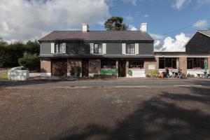 a house sitting on the side of a street at Climbers Inn in Glencar +17 photos