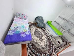 a small room with a bed and a pillow at Nur-Nomad in Balykchy