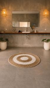 a room with a rug on the floor with a sink at Bali Eco Retreat in Bangli +9 photos