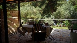 a table and chairs sitting on a patio at Life on Green in Himare