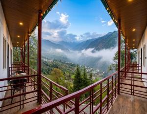 a balcony with a view of the mountains at The Chapter Stay - Kedarnath in Phata