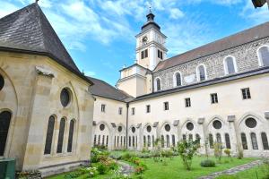 a building with a clock tower on top of it at Zisterzienserstift Lilienfeld in Lilienfeld