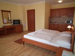 Postel nebo postele na pokoji v ubytování Hotel Járja