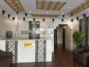 a lobby with a reception desk in a building at رحيانه ابها in Abha