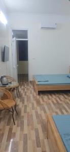 a room with a bed and a table at Cô tô xinh in Quang Ninh