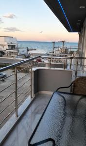 a balcony with a view of the ocean at Aleksandra Delfini Apartments in Paralia Katerinis