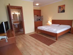 Postel nebo postele na pokoji v ubytování Hotel Járja