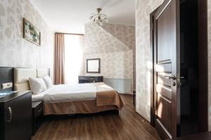 Кровать или кровати в номере Verona Hotel