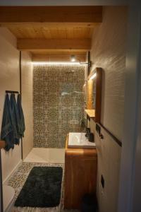 a bathroom with a sink and a shower at Kwiatowisko in Szewnia +44 photos