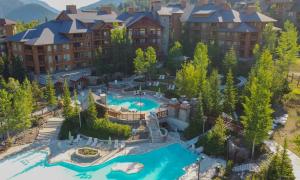 an aerial view of a resort with a swimming pool at Quiet detached home steps from all the action! in Panorama