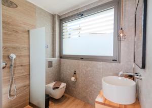 a bathroom with a sink and a large window at The Wave in Limenaria +44 photos