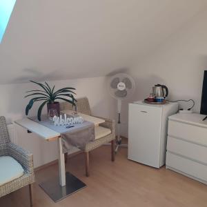 a dining room with a table with a plant on it at Međimurski San in Lopatinec