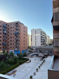 a view of a city with tall buildings at Mme apartment in Kamëz
