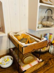 a shelf in a kitchen with bread on it at Dalen Bed & Breakfast in Dalen