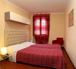 A bed or beds in a room at Claudio Appartamenti