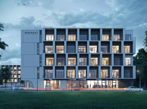 a rendering of a building with lights on at Lux Lotnisko in Wrocław