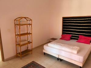 a bedroom with a bed and a book shelf at Paradise in Yène +53 photos