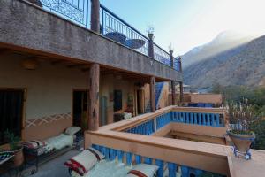 a balcony of a house with a view of a mountain at Eagle Lodge in Imlil +53 photos