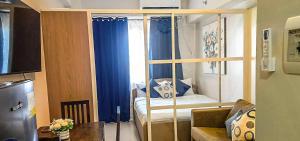a room with a room with a bed and a window at Althea's Horizon Stay - Primeworld District in Pajak +1 photo