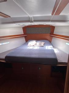 a small bed in the middle of a boat at BeliBoat in Cascais +10 photos