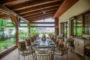 a long dining room with a long table and chairs at Porto Franco Sulina in Sulina