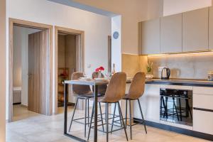 a kitchen with a table and chairs in a room at Floras House in Paradeísion +38 photos