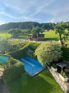 an overhead view of a swimming pool in a field at Ferienhof Bieke in Finnentrop