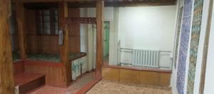 a room with two bunk beds and a window at Памирский дом in Khorog