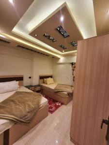 a bedroom with two beds in a room with at Alex dream in Alexandria