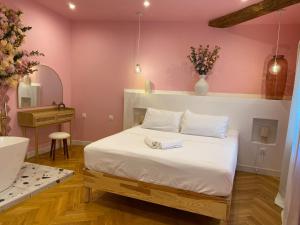 a bedroom with a bed and a sink and a mirror at Mas Beauregard in Anduze