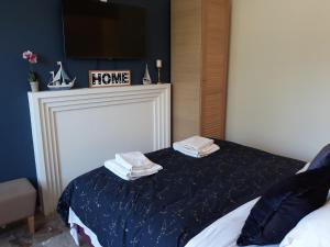 a bedroom with a bed with towels on top of it at Cozy Stay Corfu – Studio 10 in Gouvia