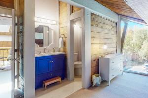 a bathroom with a blue sink and a mirror at Gore Creek Haven in Vail +26 photos