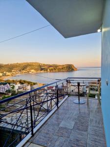 a balcony with a view of the ocean at Himara Holiday House in Himare