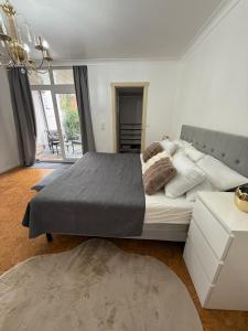 a bedroom with a large bed and a large window at Tomorrowland Home in Boom