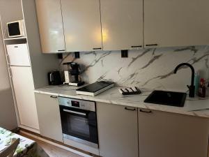 a kitchen with a counter with two laptops on it at VILLA ANNA in Naantali