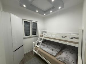 a white room with a bunk bed in it at Villa Lux Una in Bosanska Krupa +25 photos