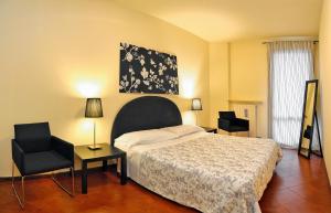 A bed or beds in a room at Claudio Appartamenti