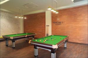 two pool tables in a room with a sign at Jula Hearth 1BHK in Chicalim