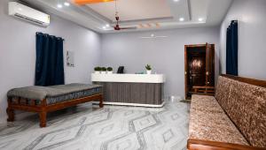 a living room with a bed and a table at Sai krishna residency in Pithāpuram
